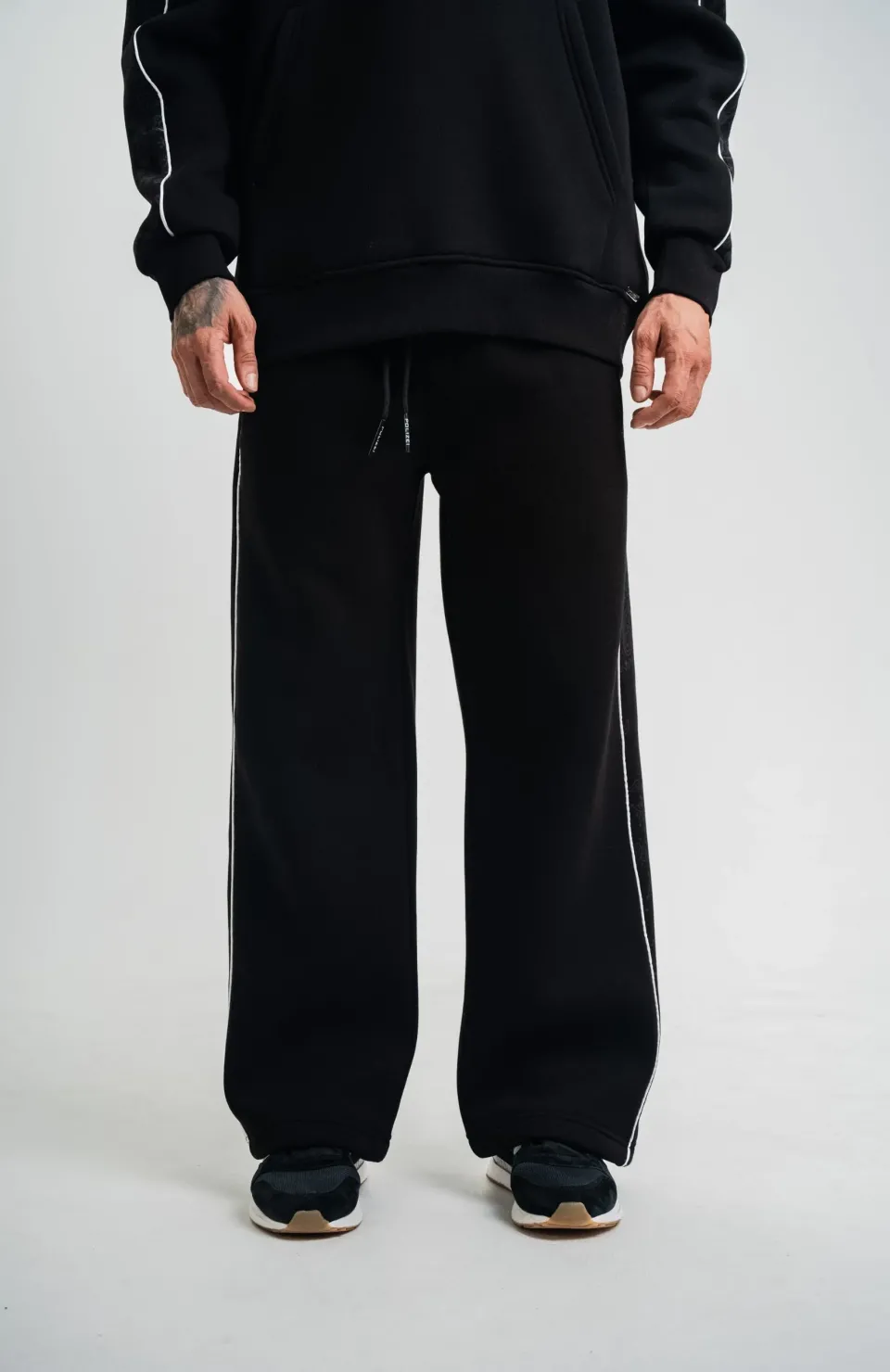 Üç İplik İçi Pamuklu Ara Biyeli Baskılı Baggy Eşofman Pantolon - Siyah Somersan Giyim | Kadın, Erkek ve Çocuk Moda